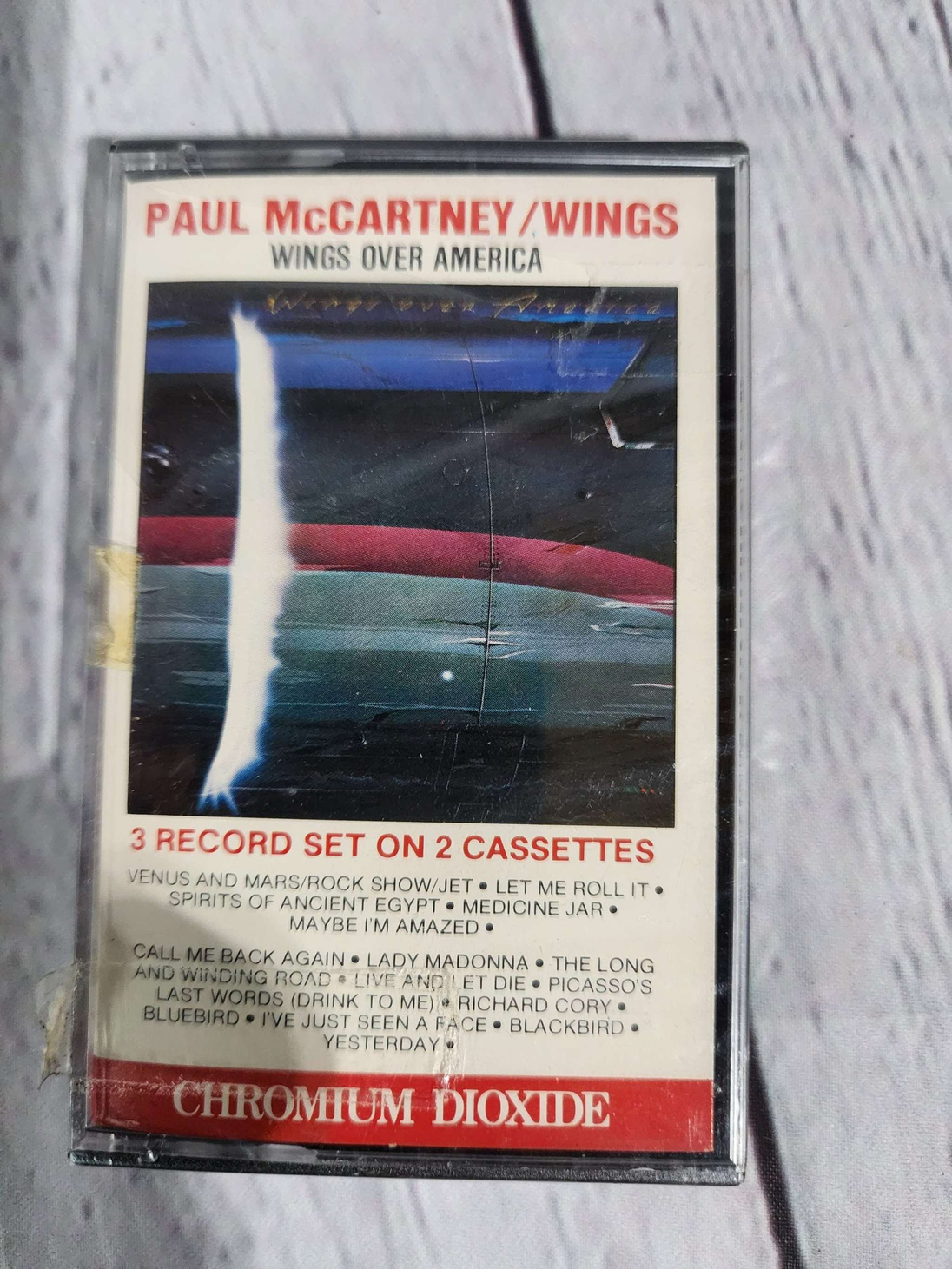 New and sealed paul mccartney wings over america  cassette 1 of 2 onlyPaul McCartney, Wings over america NEW SEALED cassette !Live album
Cassette one ONLY .......see my other listing for bothTrack list :
A1 Venus And Mars / Rock Show /Chas Vintage Shopamerica cassette 1