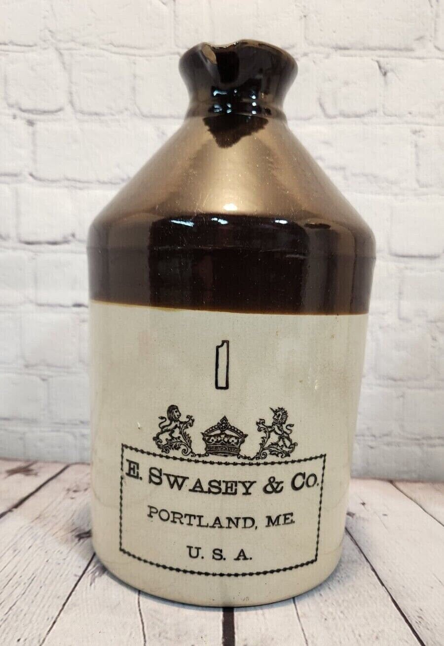 E. swasey co. portland maine 1 gallon brown beige  jug from 1800's earThis rare antique1 gallon jug from E. Swasey and CO is a true collector's item. This 1 gallon stoneware jug boasts a classic brown and beige colour scheme that exudeChas Vintage Shopportland maine 1 gallon brown beige jug