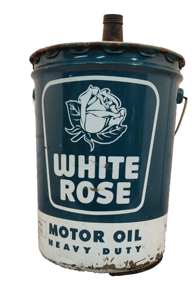 Vintage white rose heavy duty motor oil  5 gallon vintage cdn classic This vintage 5 gallon can of White Rose Motor Oil is a rare find for collectors of gas and oil memorabilia. English and french sided.Made in Canada, this original caChas Vintage ShopVintage white rose heavy duty motor oil 5 gallon vintage cdn classic oil gas Canadian Petrolinia