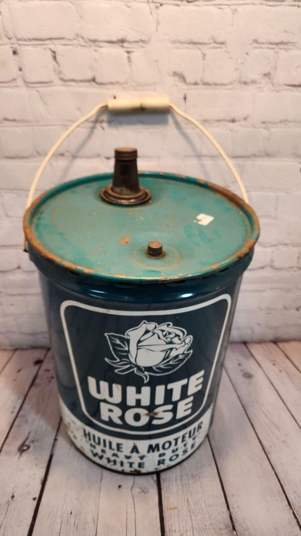 Vintage white rose heavy duty motor oil  5 gallon vintage cdn classic This vintage 5 gallon can of White Rose Motor Oil is a rare find for collectors of gas and oil memorabilia. English and french sided.Made in Canada, this original caChas Vintage ShopVintage white rose heavy duty motor oil 5 gallon vintage cdn classic oil gas Canadian Petrolinia