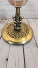 Mid century modern standing brass finish ashtray made in 60's  wtih 2 Mid century modern standing ashtray made in the 60'Brass finish with a globe in the middle and 2 Cherubs decorate the baseThis ashtray has a very elegant shape to itChas Vintage ShopMid century modern standing brass finish ashtray made