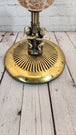 Mid century modern standing brass finish ashtray made in 60's  wtih 2 Mid century modern standing ashtray made in the 60'Brass finish with a globe in the middle and 2 Cherubs decorate the baseThis ashtray has a very elegant shape to itChas Vintage ShopMid century modern standing brass finish ashtray made