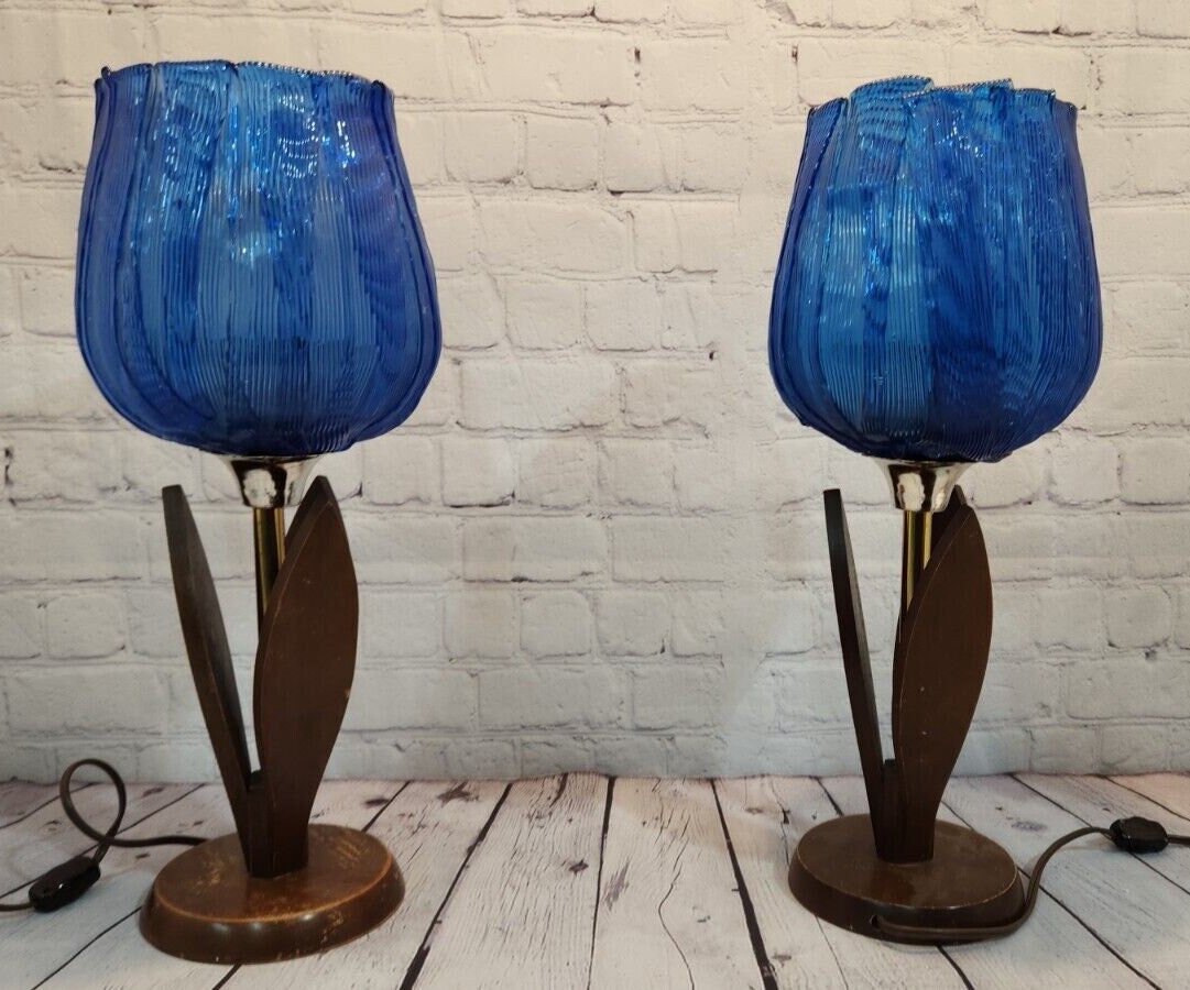 Pair of vintage blue tulip taple lamps kitsch mid century  blue tulip Add a touch of mid-century modern style to your home with this pair of vintage Blue tulip table lamps. The kitschy design and blue light color make these lamps a perChas Vintage Shopvintage blue tulip taple lamps kitsch mid century blue tulip table lamp