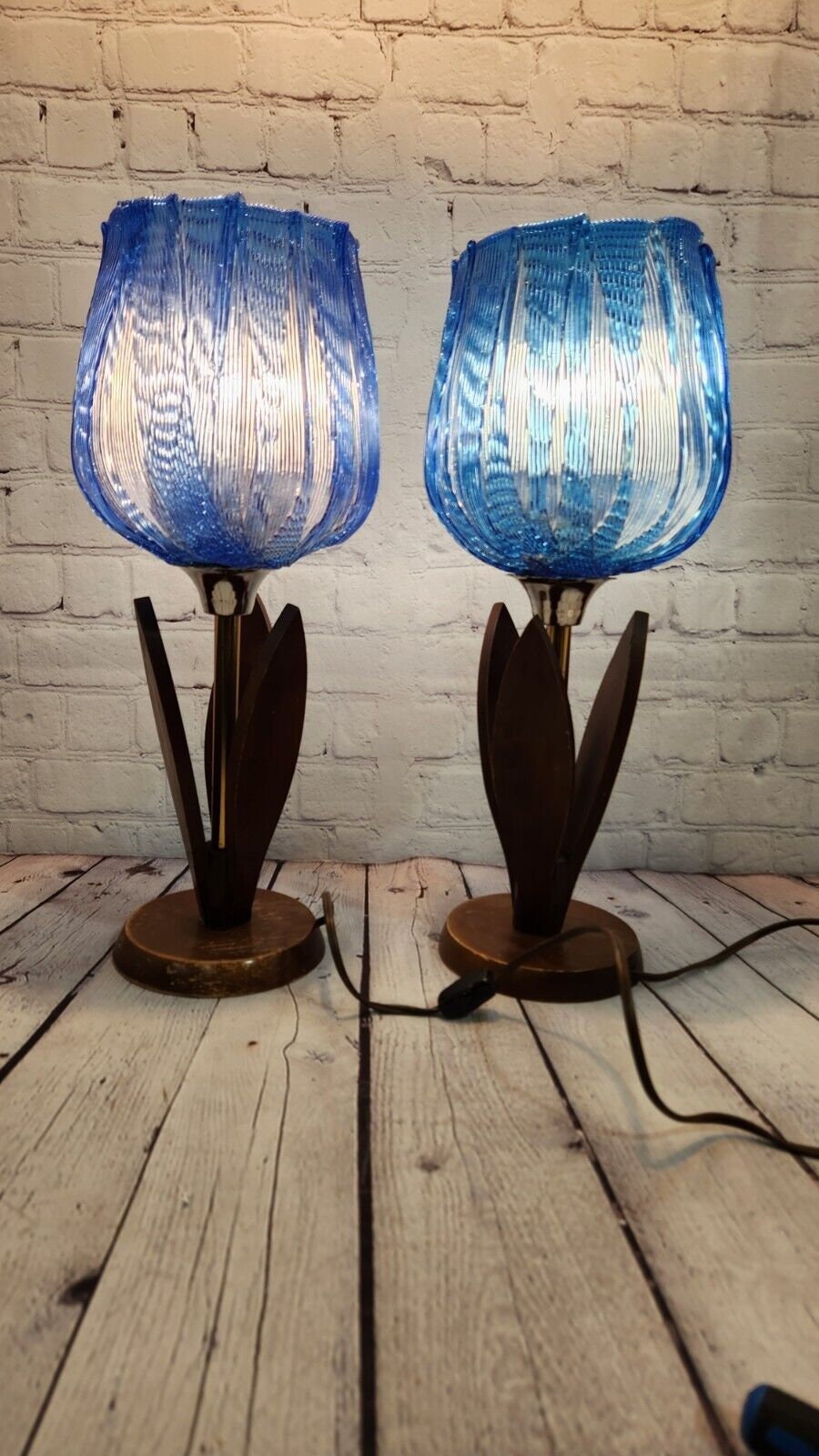 Pair of vintage blue tulip taple lamps kitsch mid century  blue tulip Add a touch of mid-century modern style to your home with this pair of vintage Blue tulip table lamps. The kitschy design and blue light color make these lamps a perChas Vintage Shopvintage blue tulip taple lamps kitsch mid century blue tulip table lamp