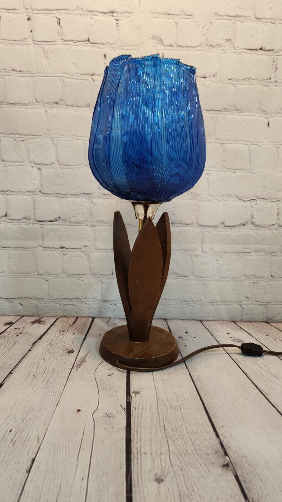 Pair of vintage blue tulip taple lamps kitsch mid century  blue tulip Add a touch of mid-century modern style to your home with this pair of vintage Blue tulip table lamps. The kitschy design and blue light color make these lamps a perChas Vintage Shopvintage blue tulip taple lamps kitsch mid century blue tulip table lamp