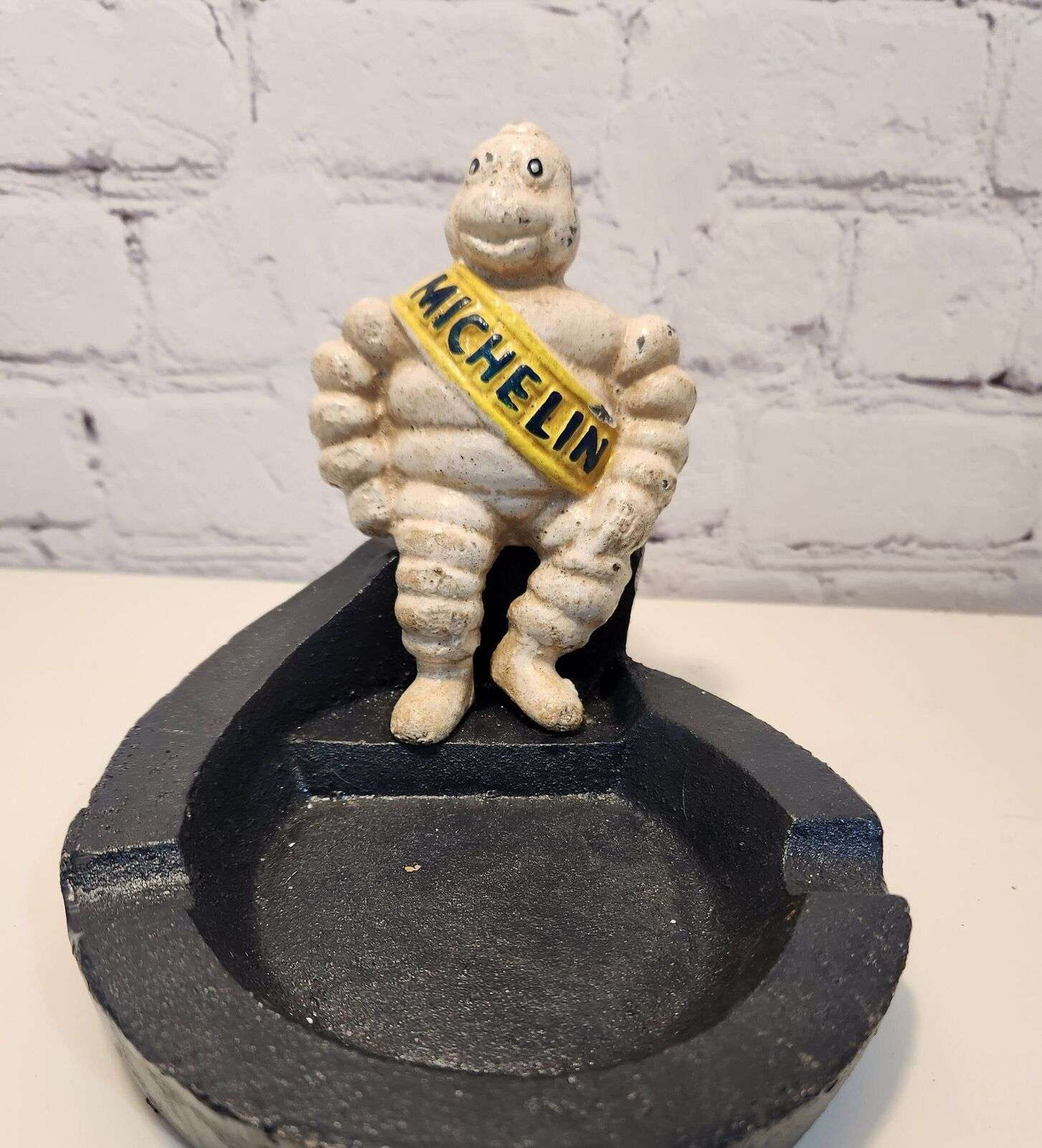 Michelin man vintage cast iron astray  bibendum cast iron vintage antiThis vintage cast iron ashtray features the iconic Michelin Mancharacter,BibendumThe heavy ashtray is a unique piece of advertising memorabilia that would make agreaChas Vintage ShopMichelin man vintage cast iron astray bibendum cast iron vintage antique