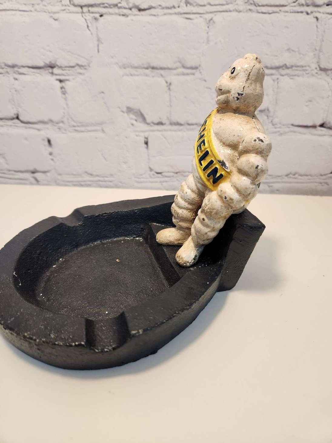 Michelin man vintage cast iron astray  bibendum cast iron vintage antiThis vintage cast iron ashtray features the iconic Michelin Mancharacter,BibendumThe heavy ashtray is a unique piece of advertising memorabilia that would make agreaChas Vintage ShopMichelin man vintage cast iron astray bibendum cast iron vintage antique