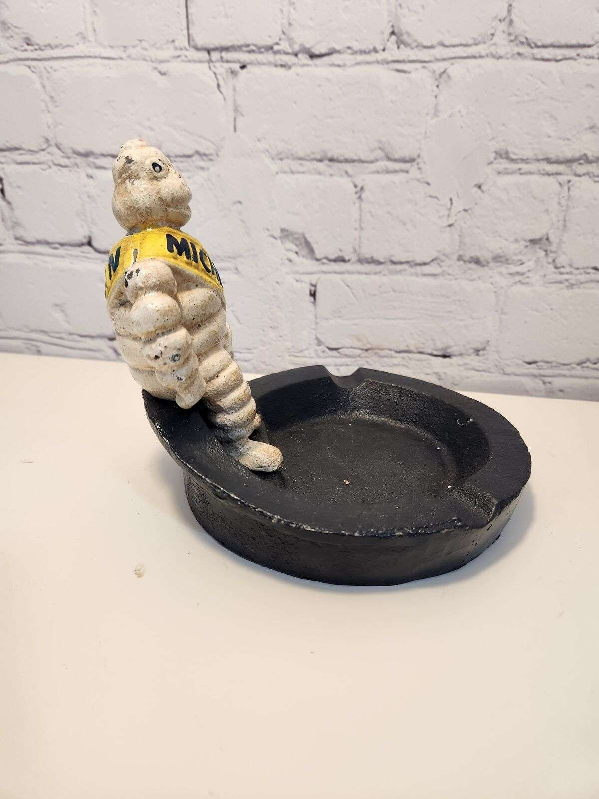 Michelin man vintage cast iron astray  bibendum cast iron vintage antiThis vintage cast iron ashtray features the iconic Michelin Mancharacter,BibendumThe heavy ashtray is a unique piece of advertising memorabilia that would make agreaChas Vintage ShopMichelin man vintage cast iron astray bibendum cast iron vintage antique