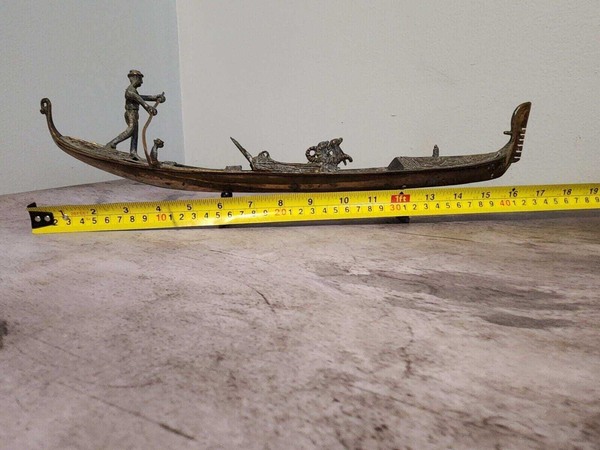 Antique solid brass venice gondola fine art sculpture that captures veThis antique solid brass Venice gondola is a fine art sculpture that captures the essence of the city's iconic waterways. Expertly crafted, the gondola is a beautifuChas Vintage ShopAntique solid brass venice gondola fine art sculpture